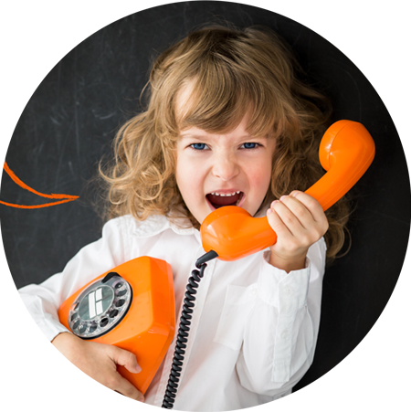 Child talking on orange telephone